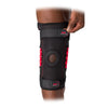 McDavid NRG Knee Brace with Heavy Duty Hinges - On Model - Tightening Strap On To Velcro